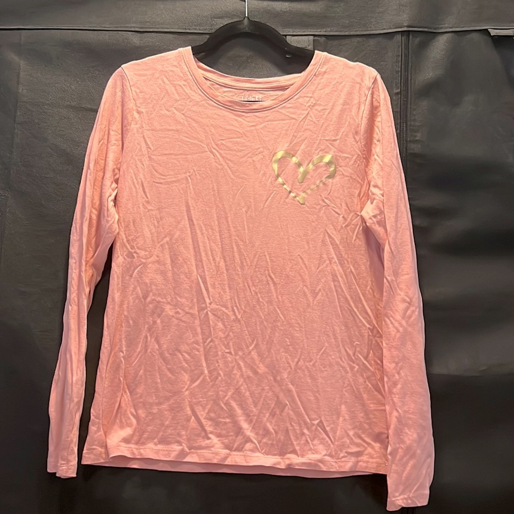 Long sleeve pink/peach colored shirt with gold heart